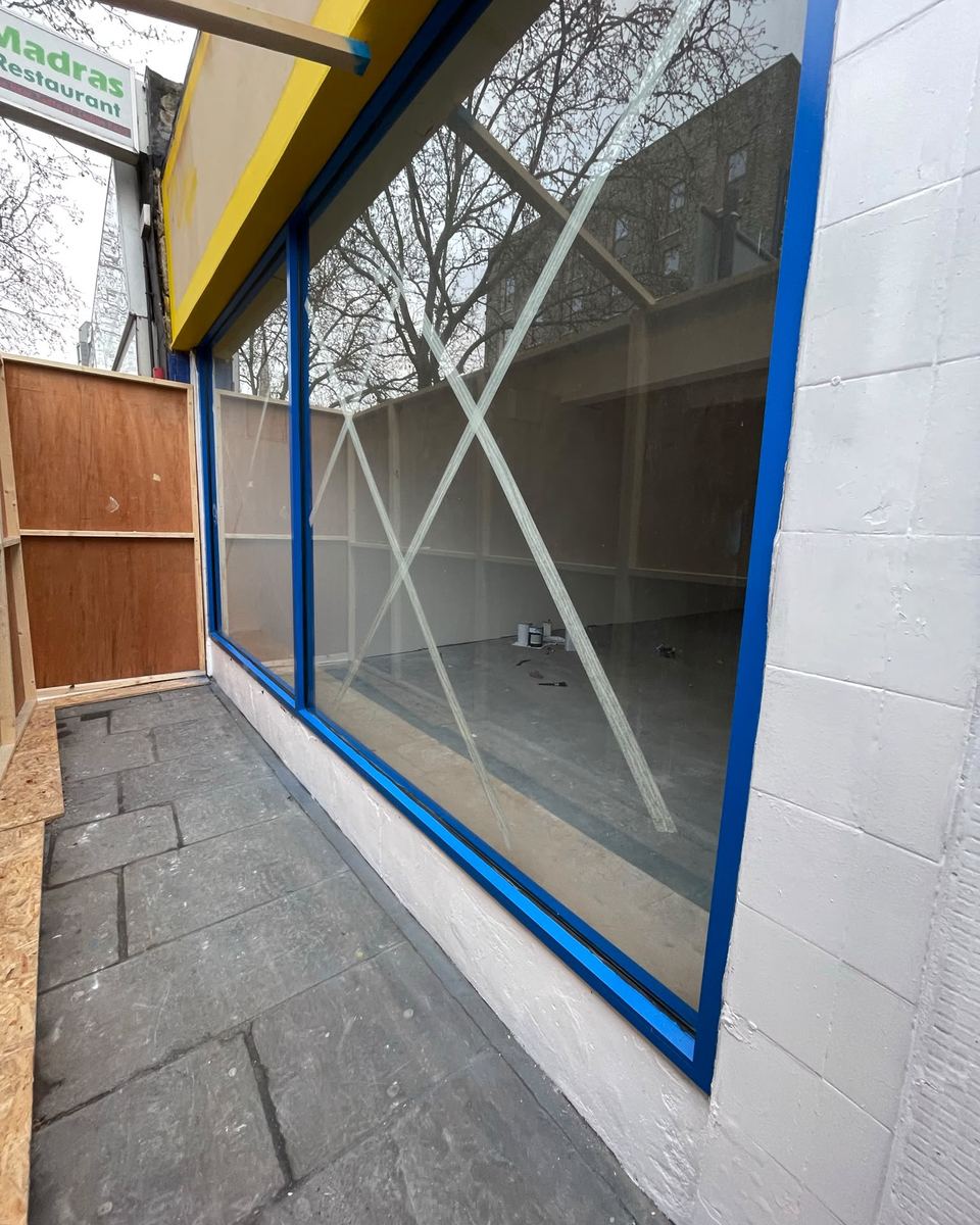 Shop front window frames after spraying